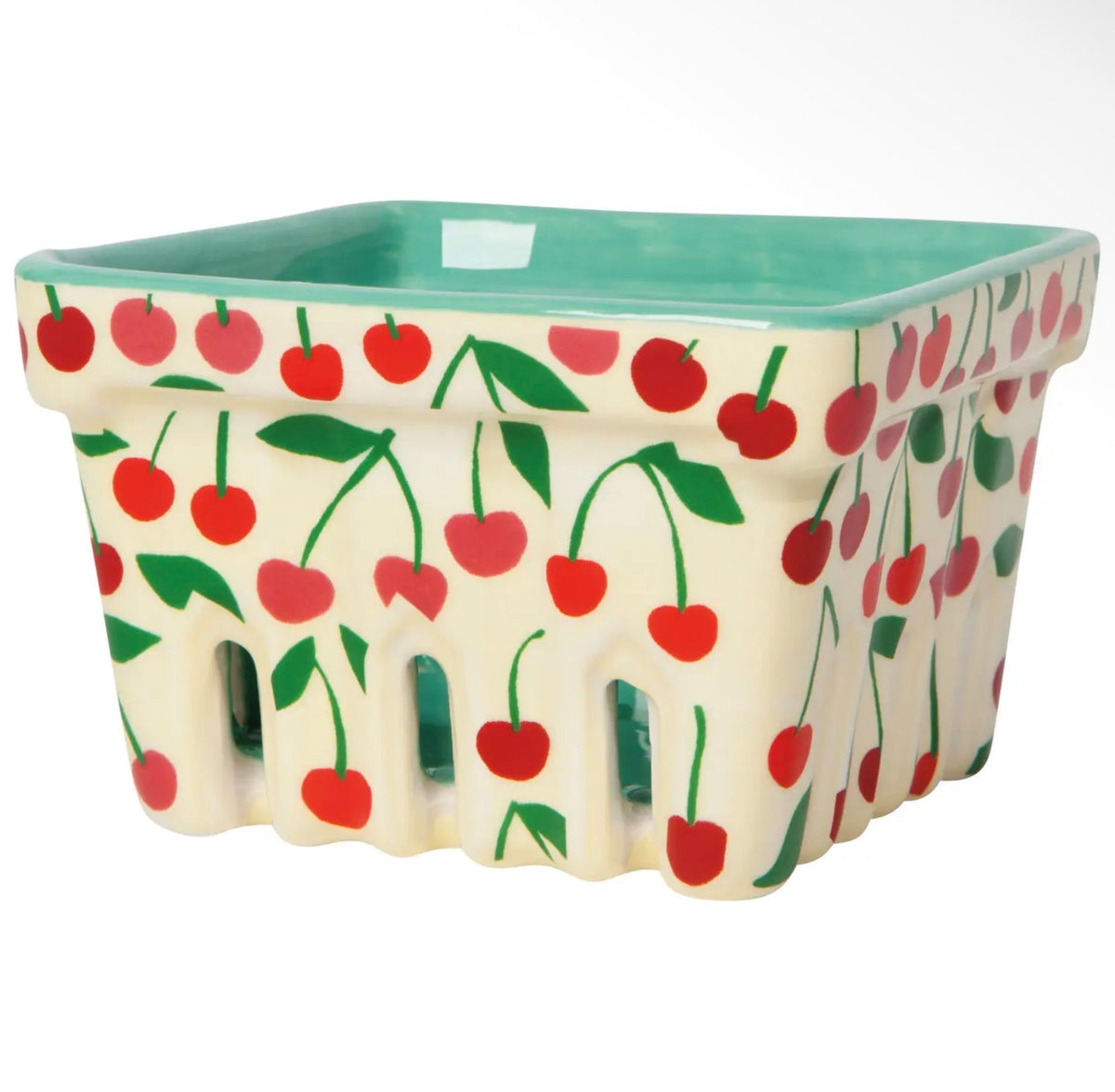 A square ceramic basket with a cream-colored exterior decorated with a red cherry and green leaf pattern, featuring a light green interior.